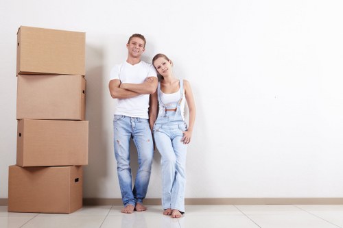 Removal team handling boxed household items during a move