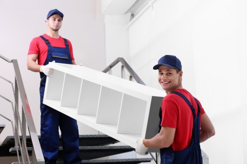 Moving boxes and furniture being handled during removals in Marylebone