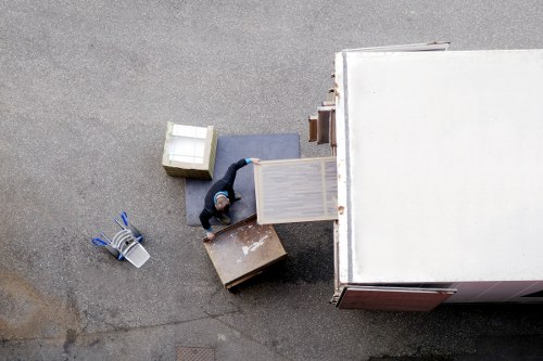 Packed boxes and furniture protection ready for removals in a central London flat