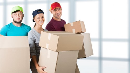 Packed moving boxes and furniture prepared for a local Marylebone relocation