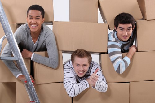 Moving team handling furniture and boxes in a Marylebone flat or townhouse